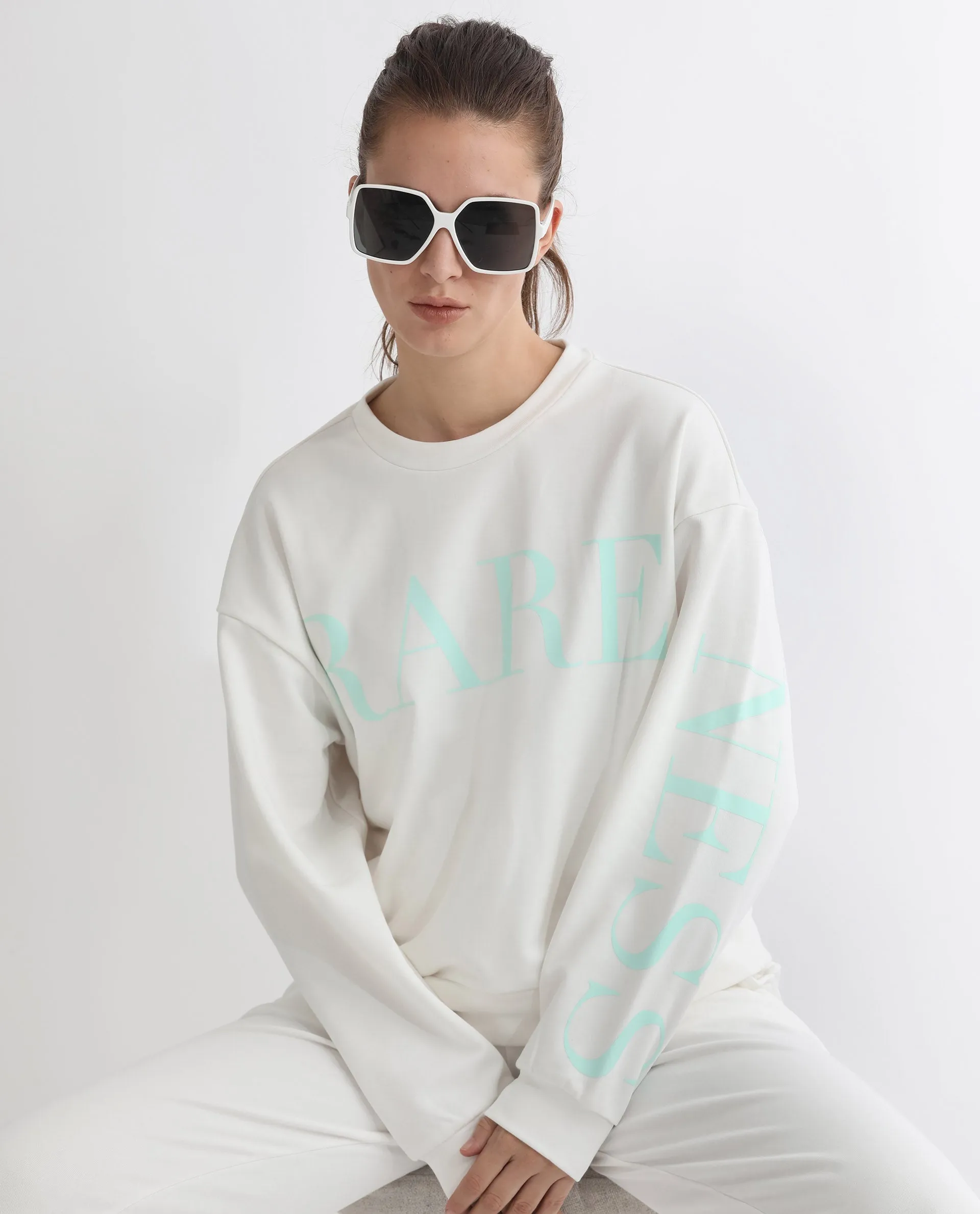 Rareism Articale Women Shelly Off White Poly Cotton Fabric Full Sleeves Cuffed Sleeve Round Neck Relaxed Fit Graphic Print Sweatshirt